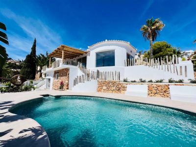 Ibiza-Mediterranean style house for sale with sea views in Moraira, with guest flat, pool, BBQ and garden.